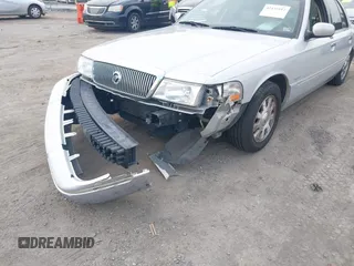 2003 Mercury Grand Marquis LS Premium z VIN 2MEFM75W03X658118, wystawiony jako IAAI lot #42435812 z przebiegiem 174 893 mil mil oraz . Historia ofert i sprzedaży dostępna na DreamBid. Obrazek 6.