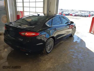 2014 Ford Fusion Titanium Hybrid with VIN 3FA6P0RU1ER290290, listed as a IAAI auction lot 41671735 with 207,405 mi miles. Bid and sale history available at carsss.com. Image 4.