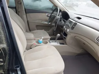2008 Kia Optima LX with VIN KNAGE123885235142, listed as a IAAI auction lot 42112119 with 145,410 mi miles. Bid and sale history available at carsss.com. Image 5.