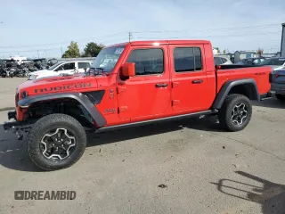 2023 Jeep Gladiator Rubicon с VIN 1C6JJTBM1PL559950, выставлен на аукционе Copart как лот 77557794 с пробегом Не указан миль и Списание • Salvage title. История ставок и продаж доступна на DreamBid. Изображение 1.