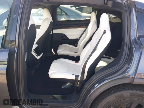2023 Tesla Model X with VIN 7SAXCBE50PF378548, listed as a IAAI auction lot 41698357 with Not Provided miles and . Bid and sale history available at DreamBid. Image 8.