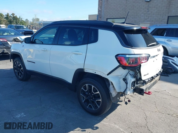 2020 Jeep Compass Trailhawk with VIN 3C4NJDDB4LT144129, listed as a IAAI auction lot 42582688 with 67,112 mi miles and . Bid and sale history available at DreamBid. Image 3.