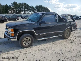 1999 Chevrolet Tahoe Z71 with VIN 1GNEK13R1XJ380316, listed as a Copart auction lot 68505524 with 242,542 mi miles and Salvage Title. Bid and sale history available at carsss.com. Image 1.