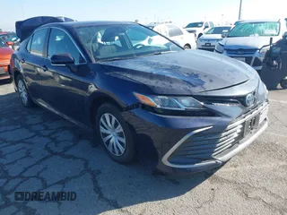 2022 Toyota Camry Hybrid LE with VIN 4T1C31AK7NU042879, listed as a IAAI auction lot 41729943 with 83,941 mi miles. Bid and sale history available at carsss.com. Image 1.