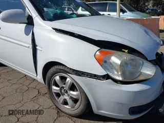 2006 Hyundai Accent GLS with VIN KMHCN46C36U040545, listed as a IAAI auction lot 42021545 with 224,058 mi miles. Bid and sale history available at carsss.com. Image 13.
