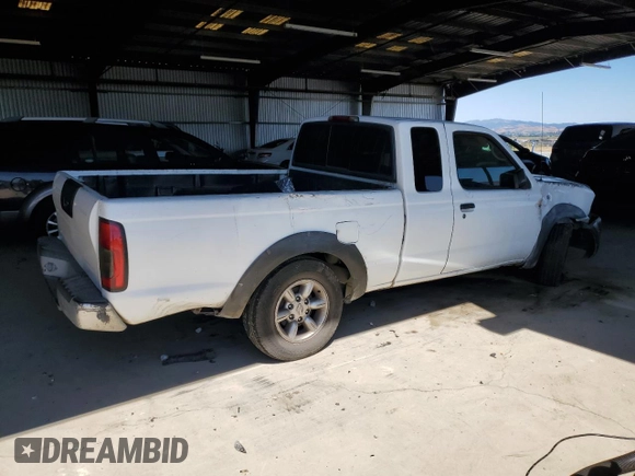 2002 Nissan Frontier XE with VIN 1N6DD26S02C309301, listed as a Copart auction lot 64142805 with 237,523 mi miles and Salvage title. Bid and sale history available at DreamBid. Image 3.