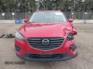 2016 Mazda CX-5 Grand Touring z VIN JM3KE4DY7G0687318, wystawiony jako IAAI lot #42228585 z przebiegiem 188 793 mil mil oraz . Historia ofert i sprzedaży dostępna na DreamBid. Obrazek 12.