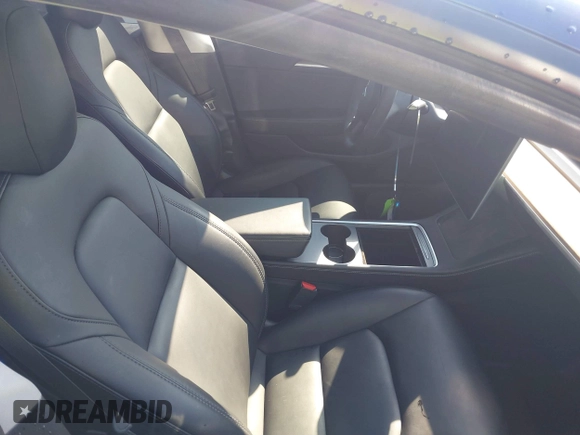 2021 Tesla Model 3 Long Range with VIN 5YJ3E1EB6MF990089, listed as a IAAI auction lot 41607316 with 25,223 mi miles and . Bid and sale history available at DreamBid. Image 5.