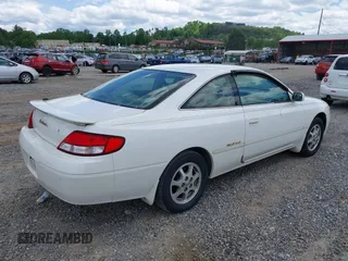 1999 Toyota Solara SE with VIN 2T1CF22PXXC233661, listed as a IAAI auction lot 42196878 with 157,682 mi miles. Bid and sale history available at carsss.com. Image 4.
