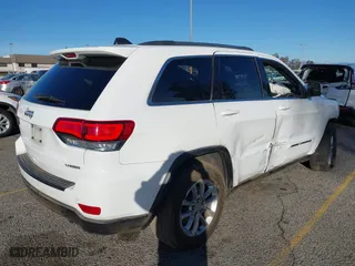 2021 Jeep Grand Cherokee Laredo X with VIN 1C4RJEAG2MC719395, listed as a IAAI auction lot 41338484 with 99,636 mi miles. Bid and sale history available at carsss.com. Image 4.
