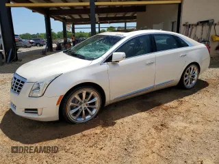 2013 Cadillac XTS Luxury with VIN 2G61P5S30D9166652, listed as a Copart auction lot 56255605 with 130,946 mi miles and Salvage title. Bid and sale history available at DreamBid. Image 1.