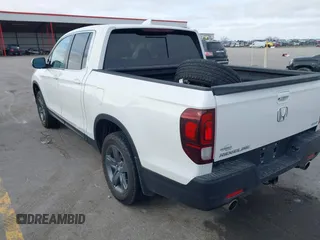 2023 Honda Ridgeline RTL with VIN 5FPYK3F55PB018188, listed as a IAAI auction lot 41952319 with 73,019 mi miles and . Bid and sale history available at DreamBid. Image 3.