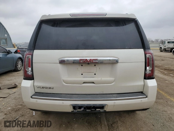 2015 GMC Yukon Denali with VIN 1GKS1CKJ1FR619793, listed as a Copart auction lot 86910314 with 128,559 mi miles and Salvage Title. Bid and sale history available at carsss.com. Image 6.