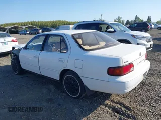 1995 Toyota Camry LE z VIN JT2SK12E5S0332027, wystawiony jako IAAI lot #42078977 z przebiegiem 128 929 mil mil oraz . Historia ofert i sprzedaży dostępna na DreamBid. Obrazek 3.