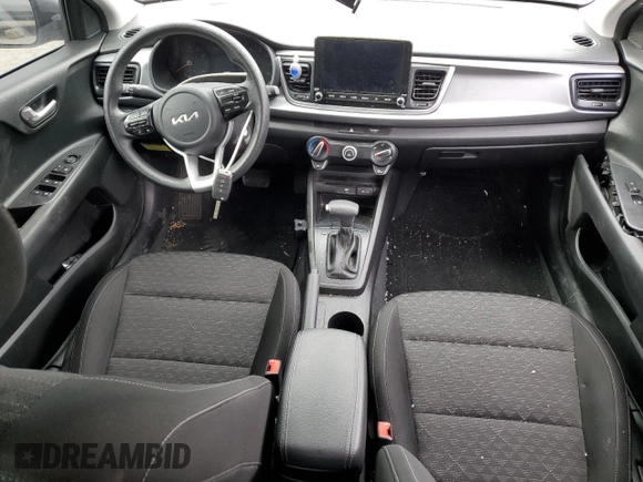 2023 Kia Rio S with VIN 3KPA24AD3PE517933, listed as a Copart auction lot 41072394 with 26,058 mi miles and Salvage Title. Bid and sale history available at DreamBid. Image 8.