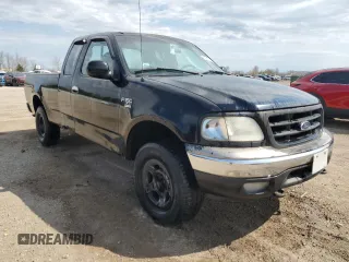 1999 Ford F-150 with VIN 1FTRX18W1XKC00918, listed as a Copart auction lot 53830305 with 205,205 mi miles and Salvage title. Bid and sale history available at DreamBid. Image 4.