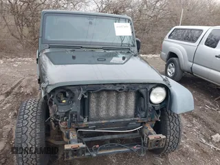 2011 Jeep Wrangler Sport with VIN 1J4AA2D18BL588273, listed as a IAAI auction lot 41857858 with 136,473 mi miles and . Bid and sale history available at carsss.com. Image 17.