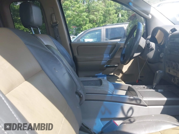 2004 Nissan Titan SE with VIN 1N6AA06A94N545539, listed as a IAAI auction lot 42036468 with 212,269 mi miles. Bid and sale history available at carsss.com. Image 5.