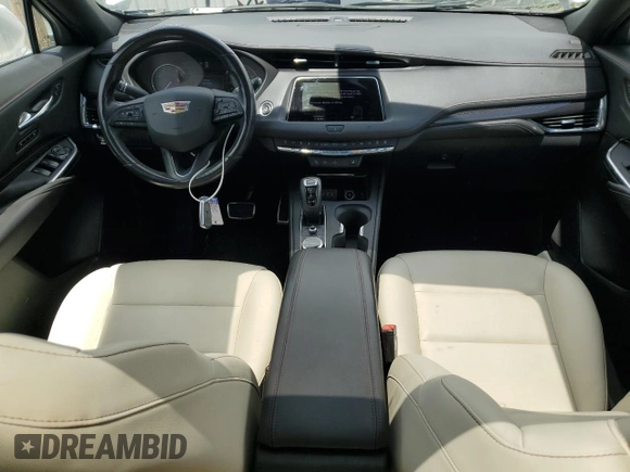2019 Cadillac XT4 FWD Sport with VIN 1GYFZER44KF210582, listed as a Copart auction lot 61272015 with 104,073 mi miles and Salvage title. Bid and sale history available at DreamBid. Image 8.