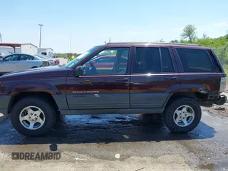 1997 Jeep Grand Cherokee TSi with VIN 1J4FX58S2VC747897, listed as a IAAI auction lot 42033868 with 119,924 mi miles. Bid and sale history available at carsss.com. Image 14.