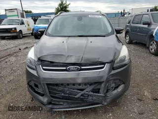 2015 Ford Escape Titanium with VIN 1FMCU9J96FUB32972, listed as a Copart auction lot 62886145 with 215,769 mi miles and Salvage title. Bid and sale history available at DreamBid. Image 5.