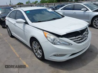 2013 Hyundai Sonata SE with VIN 5NPEC4AC2DH579871, listed as a IAAI auction lot 42011763 with 219,030 mi miles and . Bid and sale history available at DreamBid. Image 1.