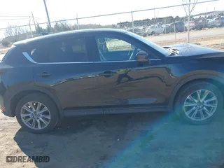2019 Mazda CX-5 Grand Touring with VIN JM3KFBDM2K0603297, listed as a IAAI auction lot 41668241 with 54,583 mi miles. Bid and sale history available at carsss.com. Image 13.