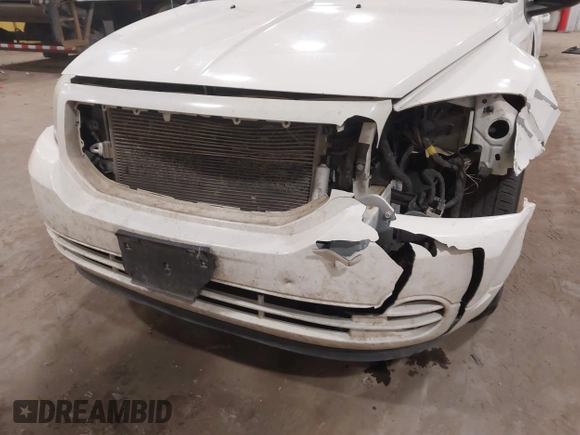 2010 Dodge Caliber SXT with VIN 1B3CB4HA3AD590654, listed as a IAAI auction lot 41814572 with 203,422 mi miles and . Bid and sale history available at DreamBid. Image 6.