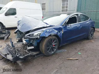 2018 Tesla Model 3 Long Range Battery with VIN 5YJ3E1EB2JF180275, listed as a IAAI auction lot 41196064 with 110,535 mi miles. Bid and sale history available at carsss.com. Image 2.