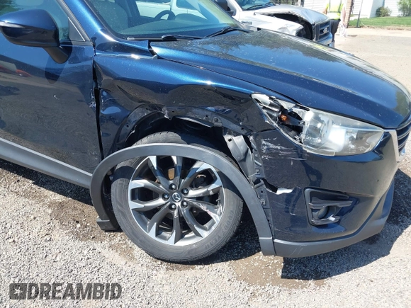 2016 Mazda CX-5 Grand Touring with VIN JM3KE4DY5G0681369, listed as a IAAI auction lot 42102805 with 128,182 mi miles and . Bid and sale history available at DreamBid. Image 6.