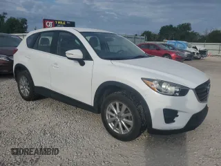 2016 Mazda CX-5 Sport with VIN JM3KE2BY0G0729349, listed as a Copart auction lot 62469735 with 88,247 mi miles and Salvage title. Bid and sale history available at DreamBid. Image 4.