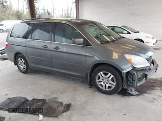 2007 Honda Odyssey EX-L z VIN 5FNRL38747B401337, wystawiony jako IAAI lot #40679439 z przebiegiem 190 909 mil mil oraz . Historia ofert i sprzedaży dostępna na DreamBid. Obrazek 1.