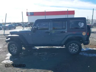 2015 Jeep Wrangler Unlimited Willys Wheeler with VIN 1C4BJWDG4FL589822, listed as a IAAI auction lot 41732614 with 149,112 mi miles and . Bid and sale history available at DreamBid. Image 15.