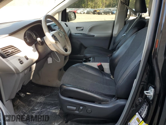 2014 Toyota Sienna SE with VIN 5TDXK3DC5ES418508, listed as a Copart auction lot 69742974 with 210,168 mi miles and Salvage Title. Bid and sale history available at DreamBid. Image 7.