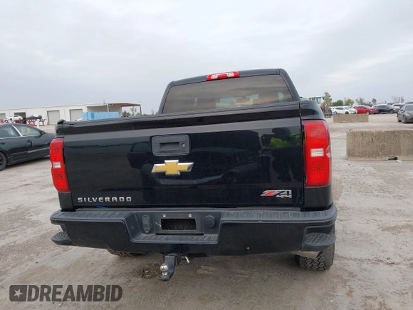 2017 Chevrolet Silverado 1500 LT with VIN 1GCUKREC2HF208232, listed as a IAAI auction lot 40933445 with 105,928 mi miles and . Bid and sale history available at DreamBid. Image 16.