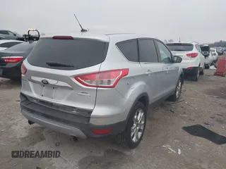 2013 Ford Escape SEL with VIN 1FMCU0H95DUA30836, listed as a IAAI auction lot 41608690 with 150,517 mi miles. Bid and sale history available at carsss.com. Image 4.