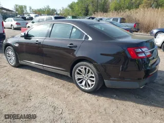 2013 Ford Taurus Limited with VIN 1FAHP2F85DG188511, listed as a IAAI auction lot 42077614 with 165,059 mi miles. Bid and sale history available at carsss.com. Image 3.