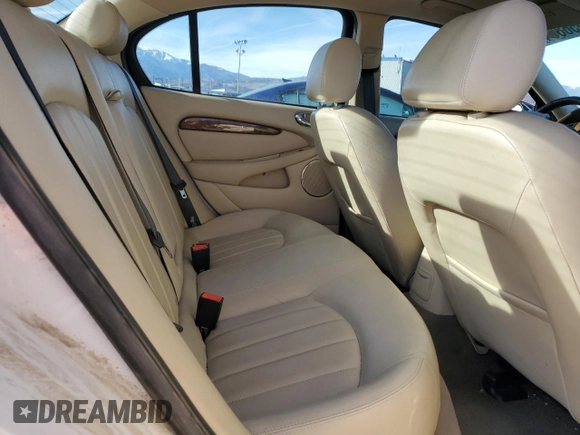 2007 Jaguar X-Type z VIN SAJWA51A07WJ14424, wystawiony jako Copart lot #84556864 z przebiegiem Nie podano mil oraz Szkody całkowita. Historia ofert i sprzedaży dostępna na DreamBid. Obrazek 10.