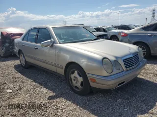 1997 Mercedes-Benz E-Class with VIN WDBJF72F2VA274233, listed as a Copart auction lot 74123554 with 80,914 mi miles and Salvage Title. Bid and sale history available at carsss.com. Image 4.
