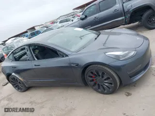 2022 Tesla Model 3 Performance with VIN 5YJ3E1EC9NF130410, listed as a IAAI auction lot 41711708 with 26,937 mi miles. Bid and sale history available at carsss.com. Image 14.