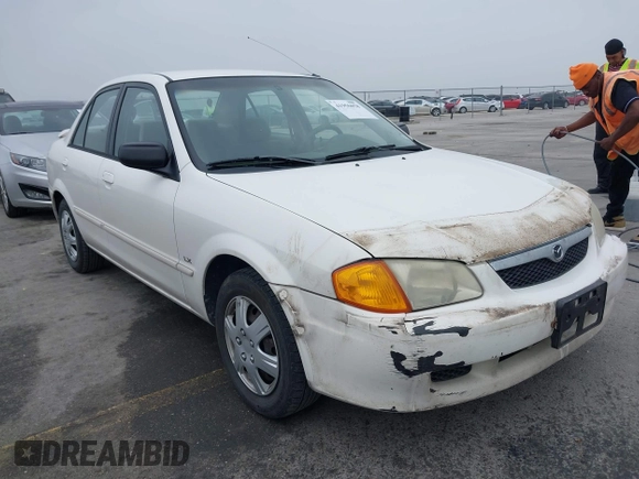 2000 Mazda Protege DX with VIN JM1BJ2220Y0273953, listed as a IAAI auction lot 41956058 with 158,837 mi miles and . Bid and sale history available at DreamBid. Image 1.