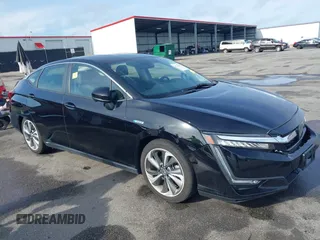 2021 Honda Clarity Touring z VIN JHMZC5F3XMC001253, wystawiony jako IAAI lot #42212102 z przebiegiem 35 649 mil mil oraz . Historia ofert i sprzedaży dostępna na DreamBid. Obrazek 1.