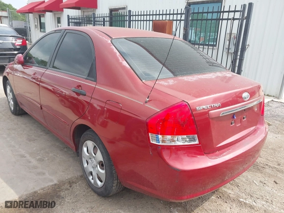 2009 Kia Spectra EX with VIN KNAFE221195606045, listed as a IAAI auction lot 42128548 with 124,577 mi miles. Bid and sale history available at carsss.com. Image 3.