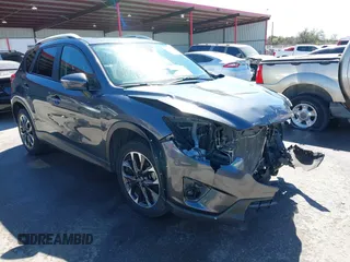 2016 Mazda CX-5 Grand Touring with VIN JM3KE2DY9G0824196, listed as a IAAI auction lot 41801887 with 88,625 mi miles. Bid and sale history available at carsss.com. Image 1.