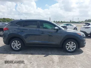 2021 Hyundai Tucson SE with VIN KM8J23A41MU291085, listed as a IAAI auction lot 41956974 with 93,932 mi miles. Bid and sale history available at carsss.com. Image 13.
