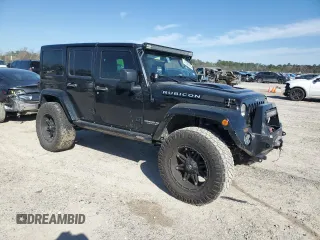 2015 Jeep Wrangler Unlimited Rubicon Hard Rock with VIN 1C4HJWFG1FL710264, listed as a Copart auction lot 47563975 with 96,737 mi miles and Salvage title. Bid and sale history available at DreamBid. Image 4.