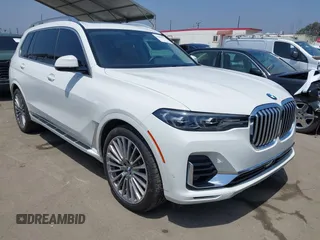 2019 BMW X7 xDrive50i z VIN 5UXCX4C54KLS38649, wystawiony jako IAAI lot #42435379 z przebiegiem 60 905 mil mil oraz . Historia ofert i sprzedaży dostępna na DreamBid. Obrazek 1.