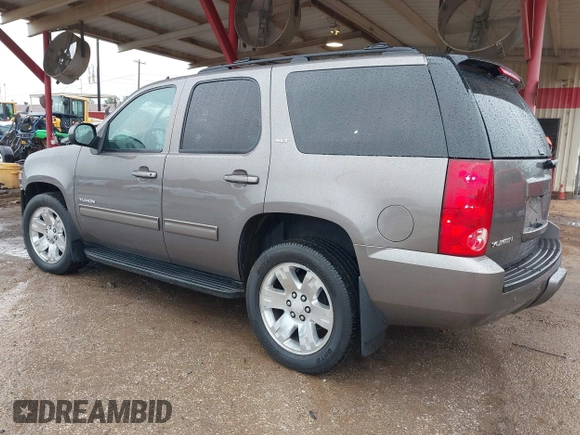 2014 GMC Yukon SLT with VIN 1GKS1CE00ER164663, listed as a IAAI auction lot 41547771 with 178,998 mi miles. Bid and sale history available at carsss.com. Image 3.