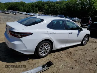 2023 Toyota Camry LE z VIN 4T1R11AK5PU792249, wystawiony jako Copart lot #58578705 z przebiegiem 20 839 mil mil oraz Szkoda całkowita • Salvage title. Historia ofert i sprzedaży dostępna na DreamBid. Obrazek 3.