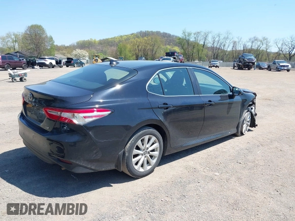 2020 Toyota Camry LE with VIN 4T1C11AK9LU387012, listed as a IAAI auction lot 42103647 with 64,049 mi miles and . Bid and sale history available at carsss.com. Image 4.